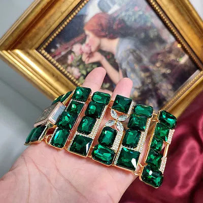 Antique court retro bracelet watch with round glass and coloured glaze dial and alloy bracelet