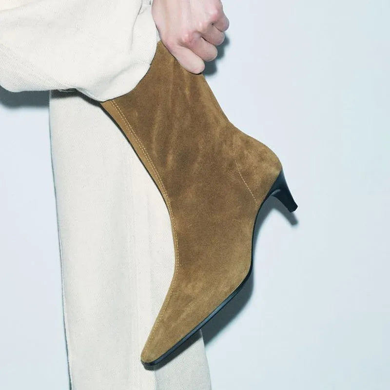 Brown square-toe kitten heel ankle boots with a side zipper on a white background.
