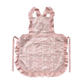 Minimalist cotton linen apron with X-strap design and lace details in light pink colour