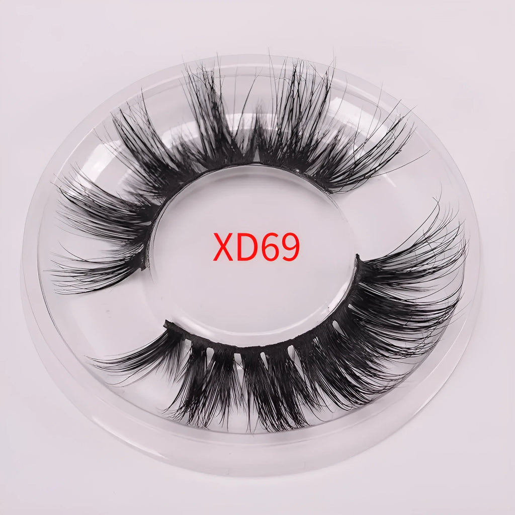 A pair of Affectionate brand 5D false eyelashes made from mink hair, shown with a storage cap and double-headed brush.
