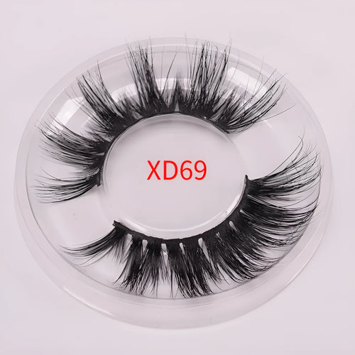 A pair of Affectionate brand 5D false eyelashes made from mink hair, shown with a storage cap and double-headed brush.