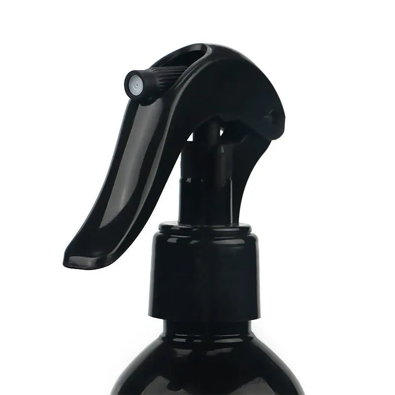 Bottle of liquid automotive coating agent spray for car polish and protection.
