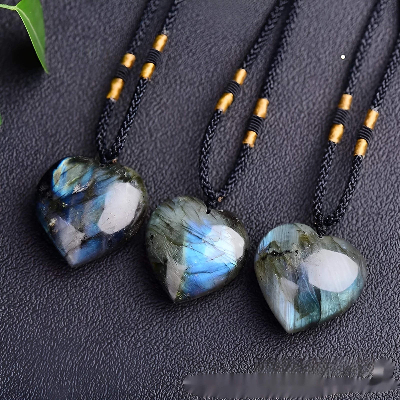Blue light natural crystal heart pendant necklace on a silver chain, showing size options.