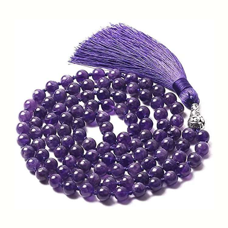 Long geometric agate and gemstone tassel necklace showing colourful beads including amethyst and lapis lazuli.