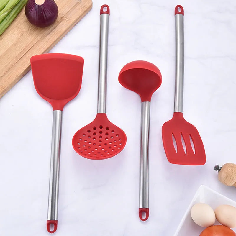 Silicone kitchenware set with stainless steel tube handles includes soup spoon, spaghetti claw, food clip, spatulas, hollow shovel, colander, egg beater in black and red