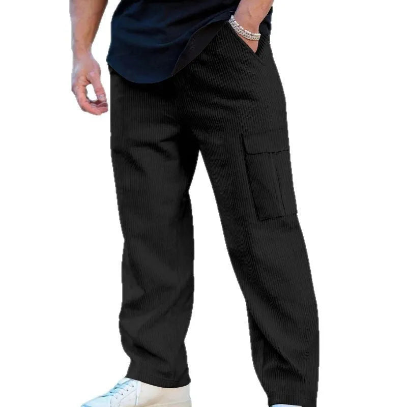 Men's navy blue corduroy cargo trousers with loose fit and straight legs on a hanger.