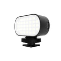 ST-30 black handheld mobile phone fill light with digital display, cold shoe mount, and colour palettes.