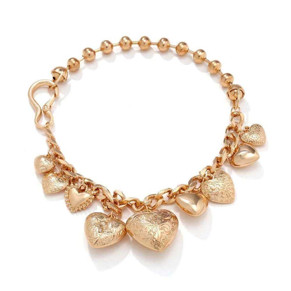 Gold carved heart pendant necklace on a metal chain, adjustable from 41cm to 50cm.