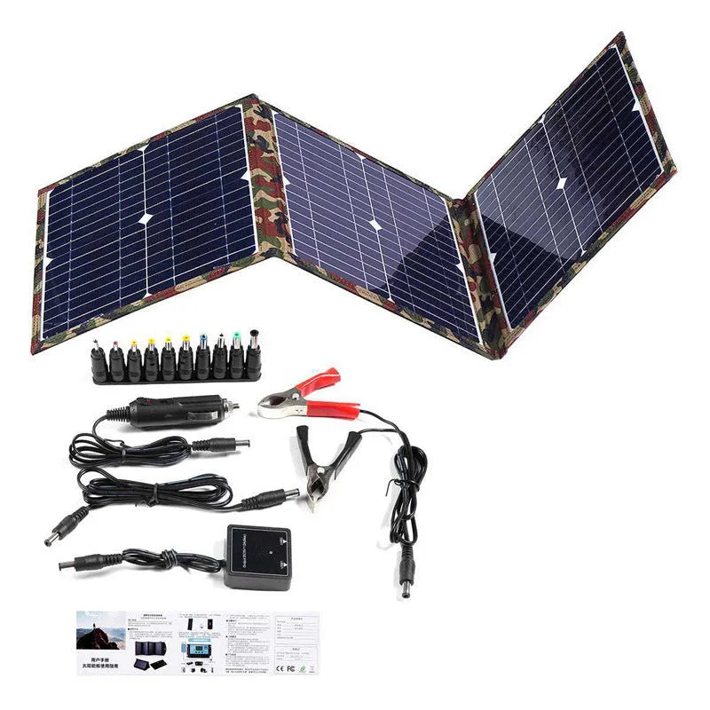 Black foldable portable solar panel unfolded showing three solar cell sections, with battery clips and car charger accessories