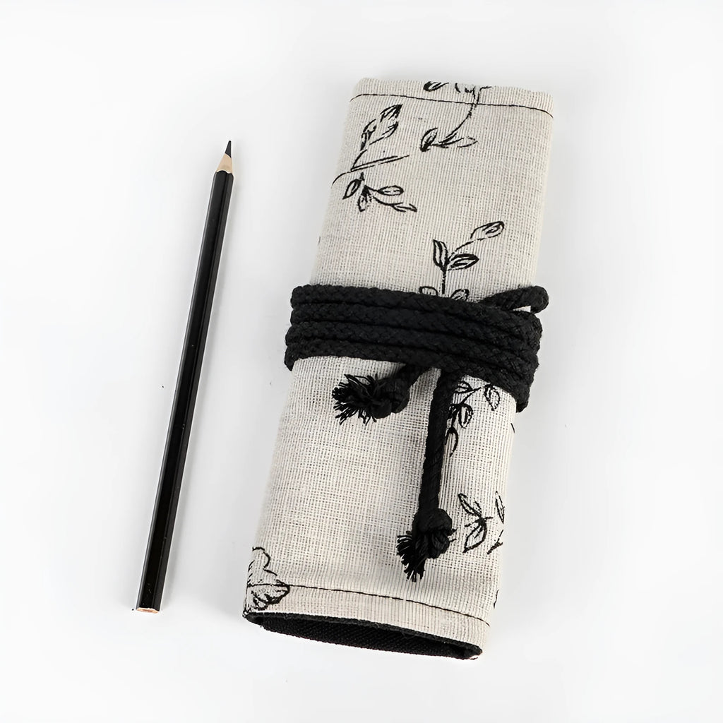 Black peony floral print canvas pencil roll bag open to show multiple tool holes.