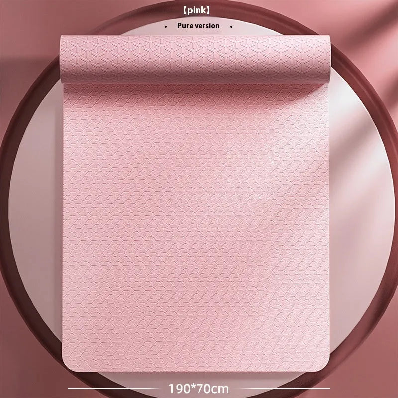 Monet pink TPE fitness mat with printed guide lines, shown rolled and unrolled on a floor.