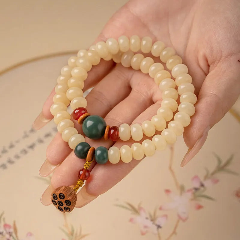 Milk butter coloured Bodhi root wooden bracelet with 6x9mm flat round beads and double ring design