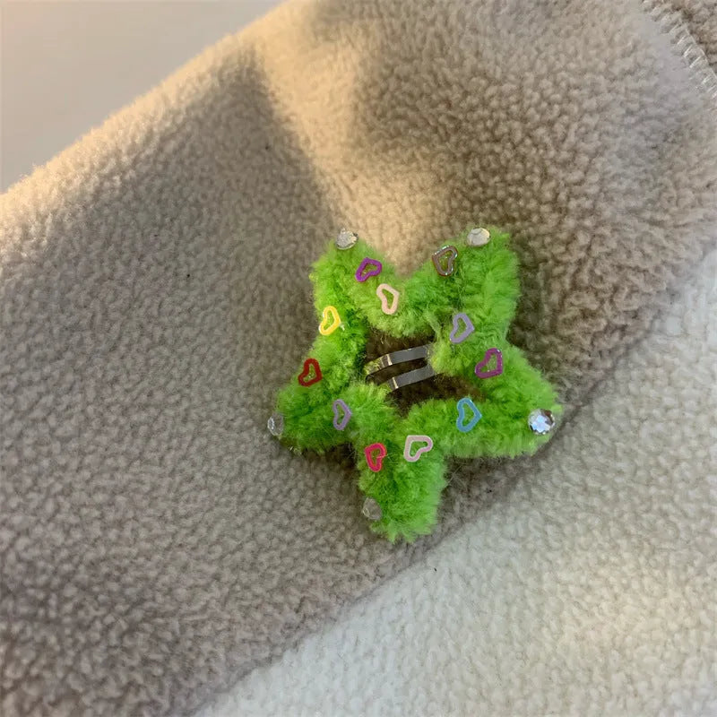 Plush diamond-encrusted five-pointed star hair clip for bangs in multiple colours including green, red, and yellow