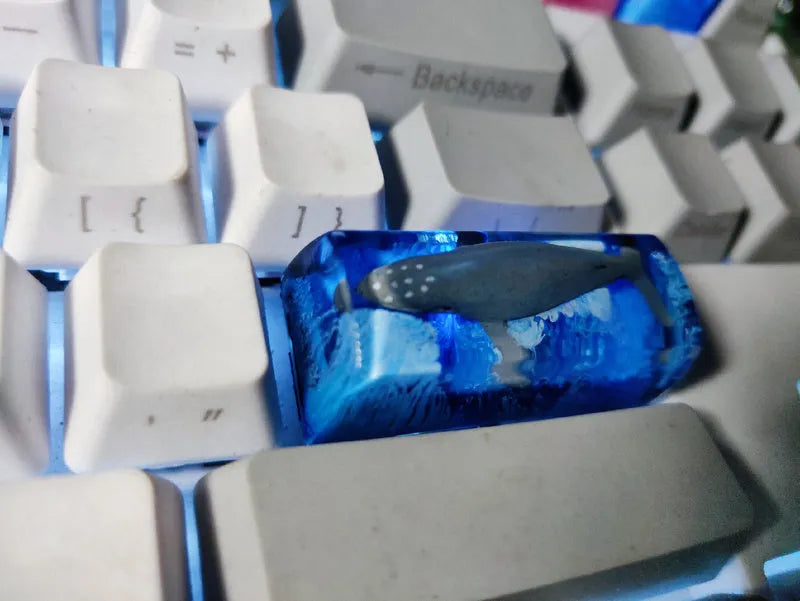 Resin keycap with koi fish swimming through scenery design for Cherry MX mechanical keyboards