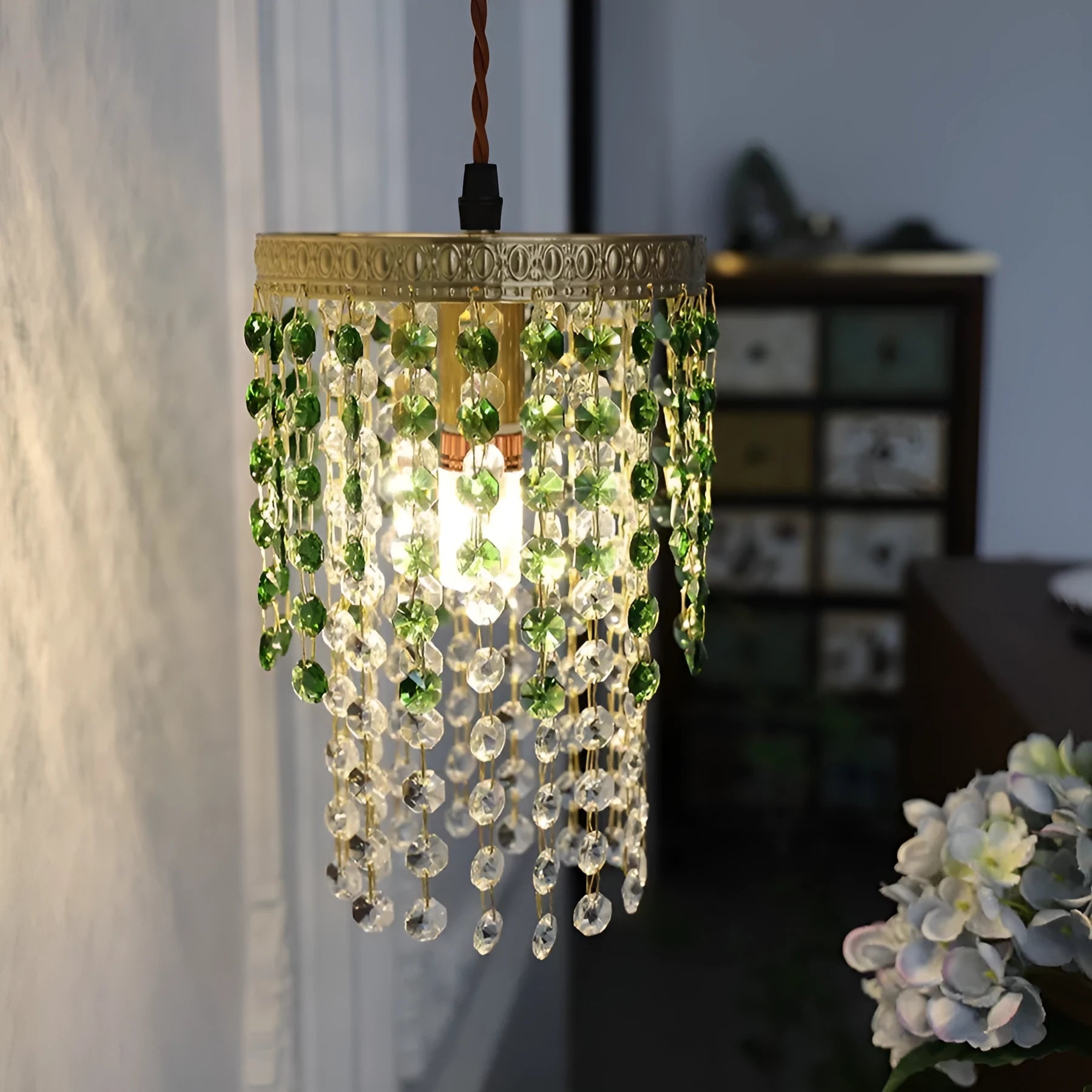Retro green glacier bedside crystal small droplight with light luxury style on a wooden surface