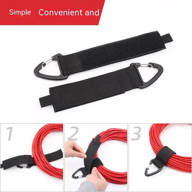 Black heavy-duty storage strap with carabiner hook and gravity strap climbing button for tool organisation