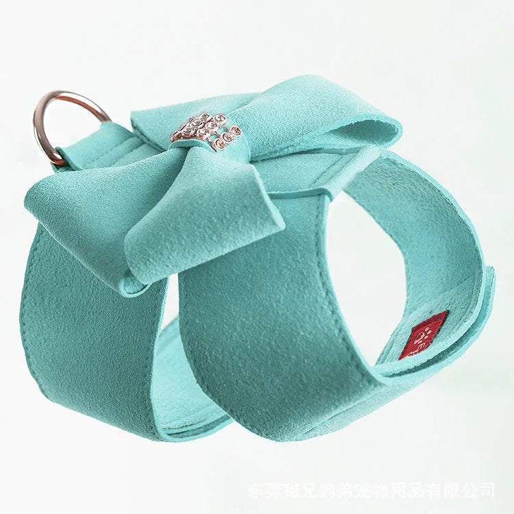 Cute pink puppy harness with a bowknot, made from soft microfiber, shown on a small dog.