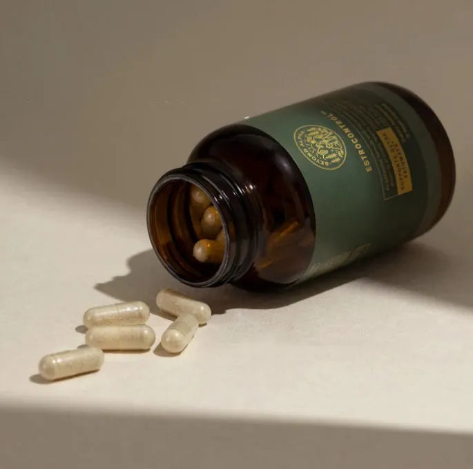 Women's hormone vitamin capsules in burgundy bottle with 72 tablets