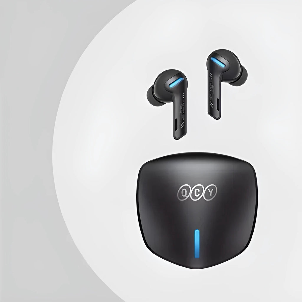 Grey QCY G1 wireless Bluetooth gaming headset with charging case and three sizes of silicone ear caps.