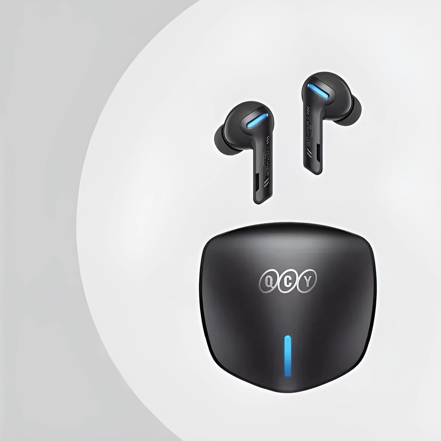 Grey QCY G1 wireless Bluetooth gaming headset with charging case and three sizes of silicone ear caps.