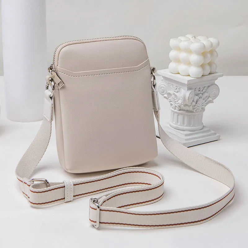 Solid colour small crossbody shoulder bag for mobile phones in beige.