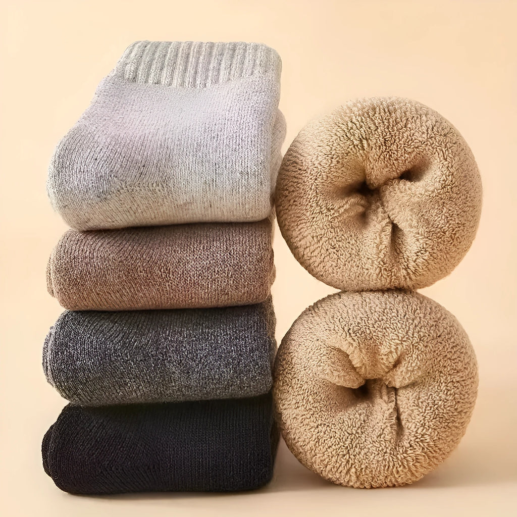 Two pairs of thick solid-colour wool socks in black, khaki, grey, or dark grey, laid flat.