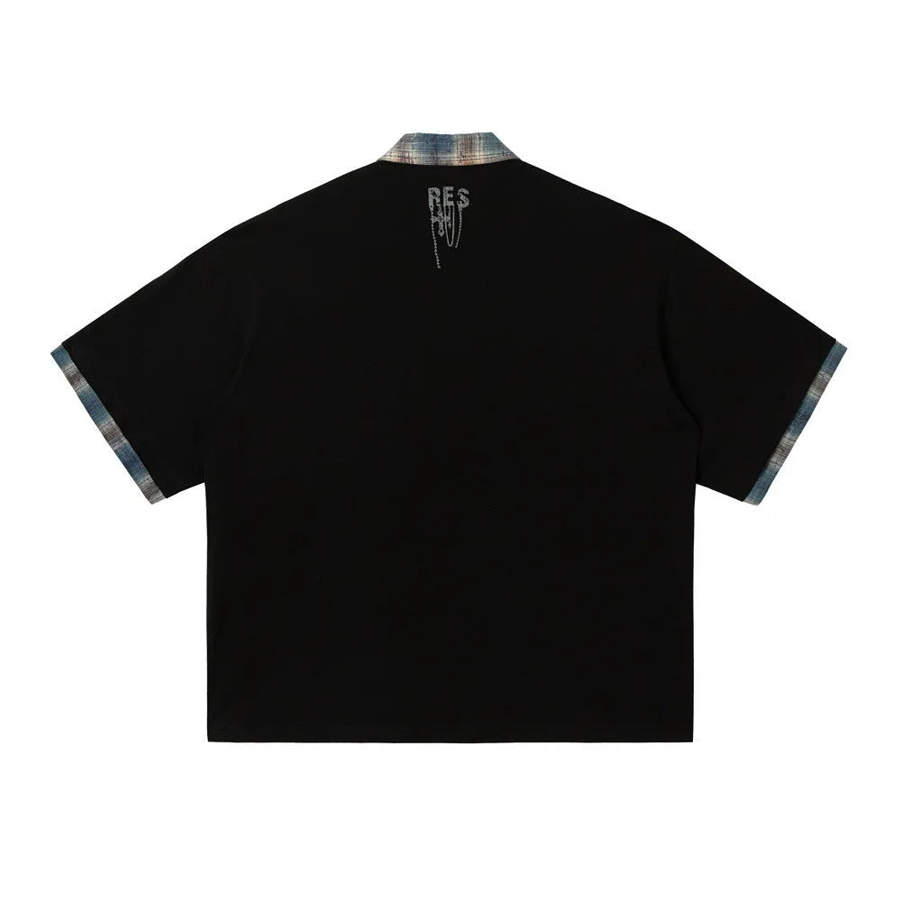 Men's loose blue short-sleeved top with asymmetric cut and graffiti print on the lapel.