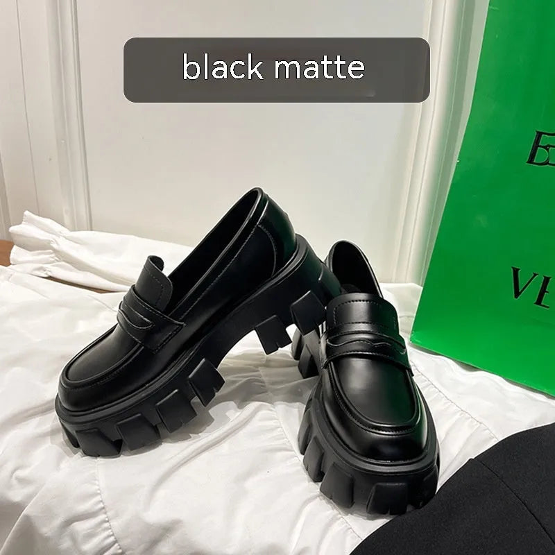 A pair of British style wide fit loafers in patent leather and matte finish options.