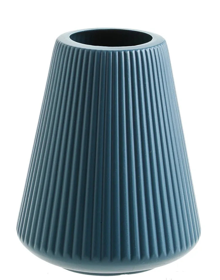Blue melamine plastic decorative flower vase measuring 16cm by 20cm on a desktop.