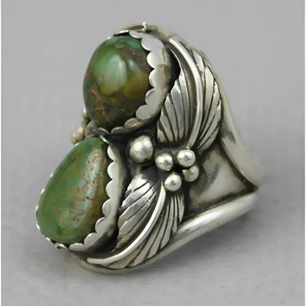 Turquoise geometric alloy ring with retro inlaid design on grey background