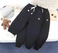Children's trousers with drawstring waist and ribbed hem, sizes 22-26, black or blue, 96% polyester 4% spandex