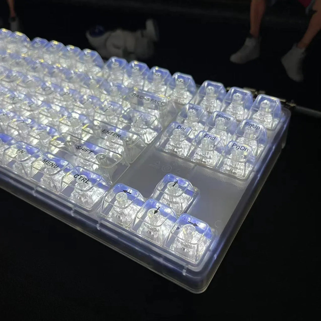 Transparent plastic 132-key mechanical keyboard cap set displayed in standard layout arrangement