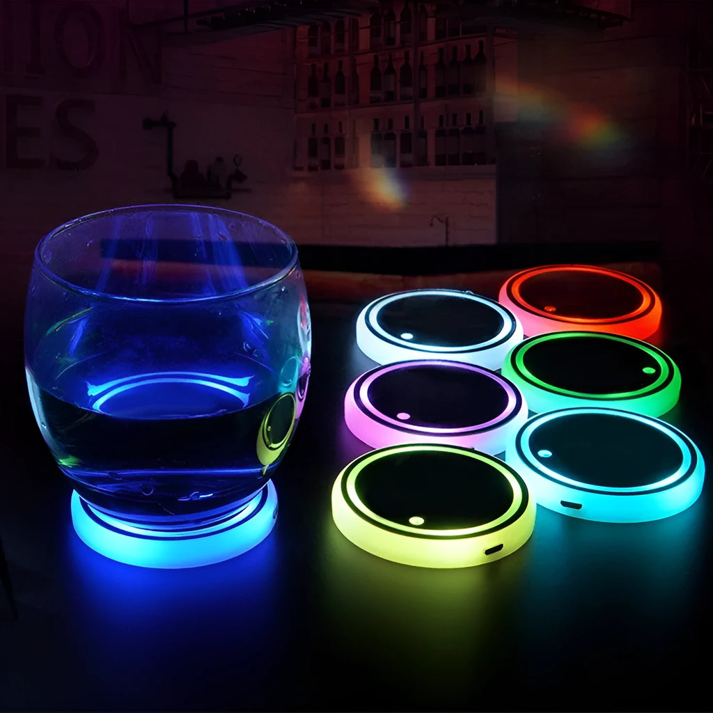 Colourful LED light-up coaster for car cup holder with solar panel and USB cable.