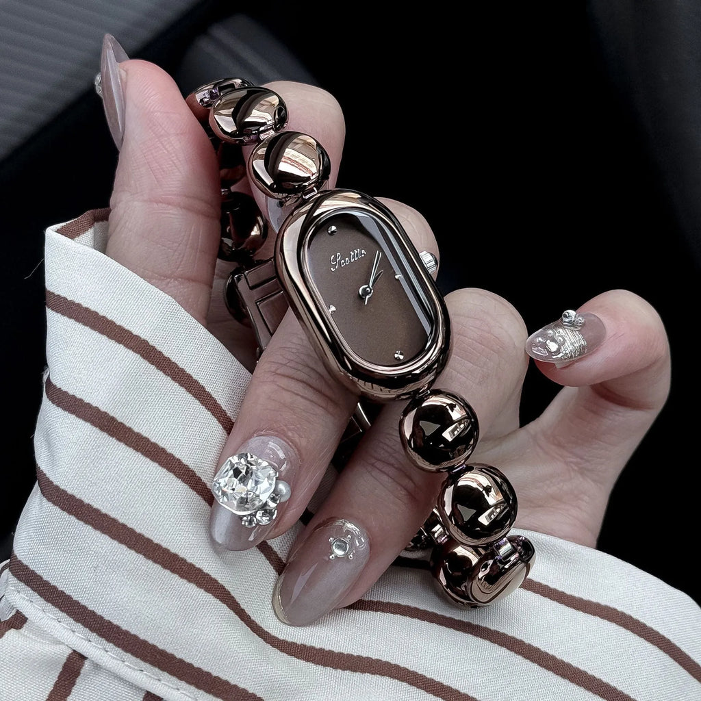Oval women's watch with 9mm case thickness shown in multiple colour finishes