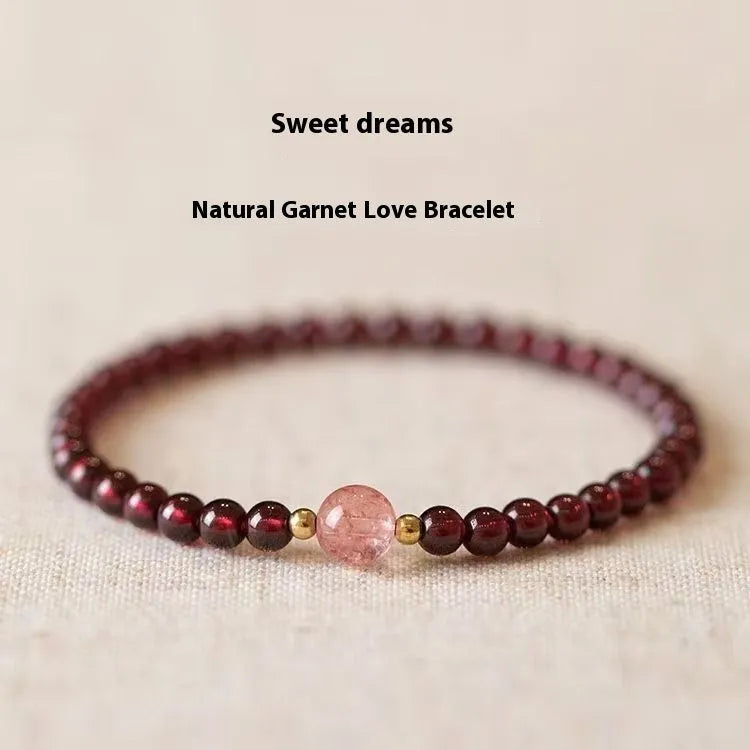 Women's garnet bracelet with U-shaped design showing polished stones in garnet colour