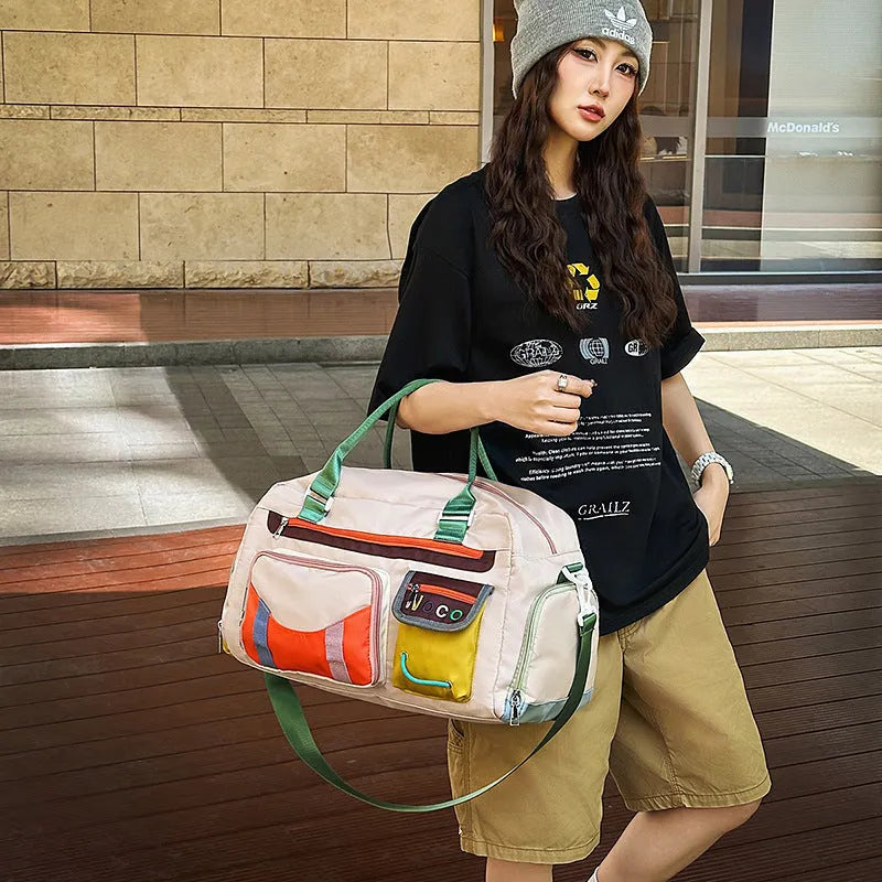 Large capacity Oxford cloth sports shoulder messenger bag in black or khaki with 36-55L storage
