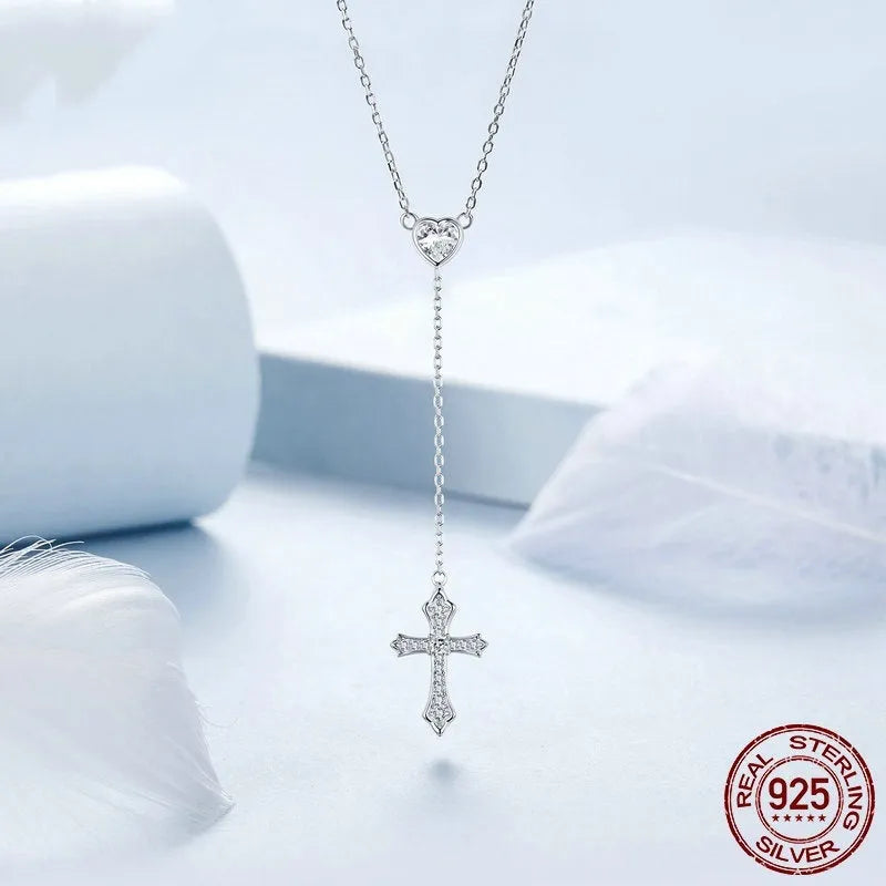 Women's simple V-neck Love cross pendant necklace made from 925 silver on an O-ring chain.
