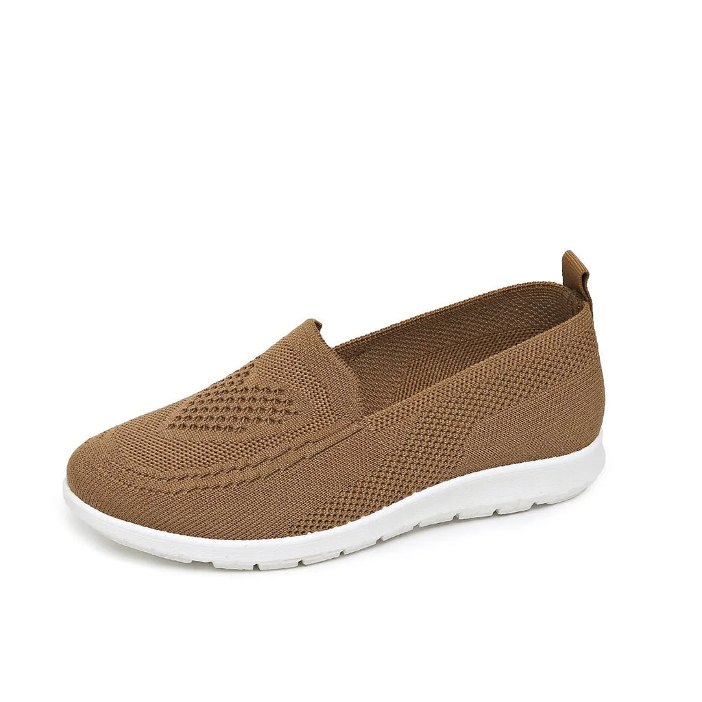 Plus size women's low-top leisure cloth shoes in beige with a heart-shaped pattern and flat sole.