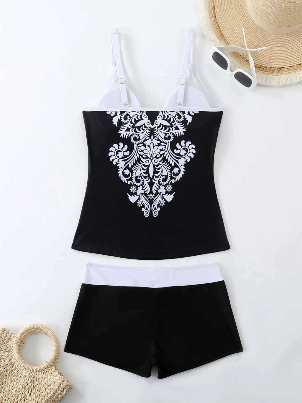 Plus size women's swimsuit set with brief-style top and matching swim shorts in black or rose red