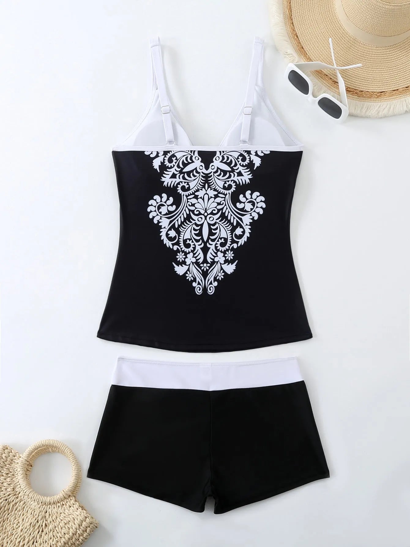 Plus size women's swimsuit set with brief-style top and matching swim shorts in black or rose red