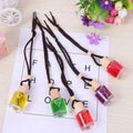 Car air freshener glass bottle hanging ornament showing scent options: Lavender, Lemon, Apple, Strawberry, Ocean, Floral.