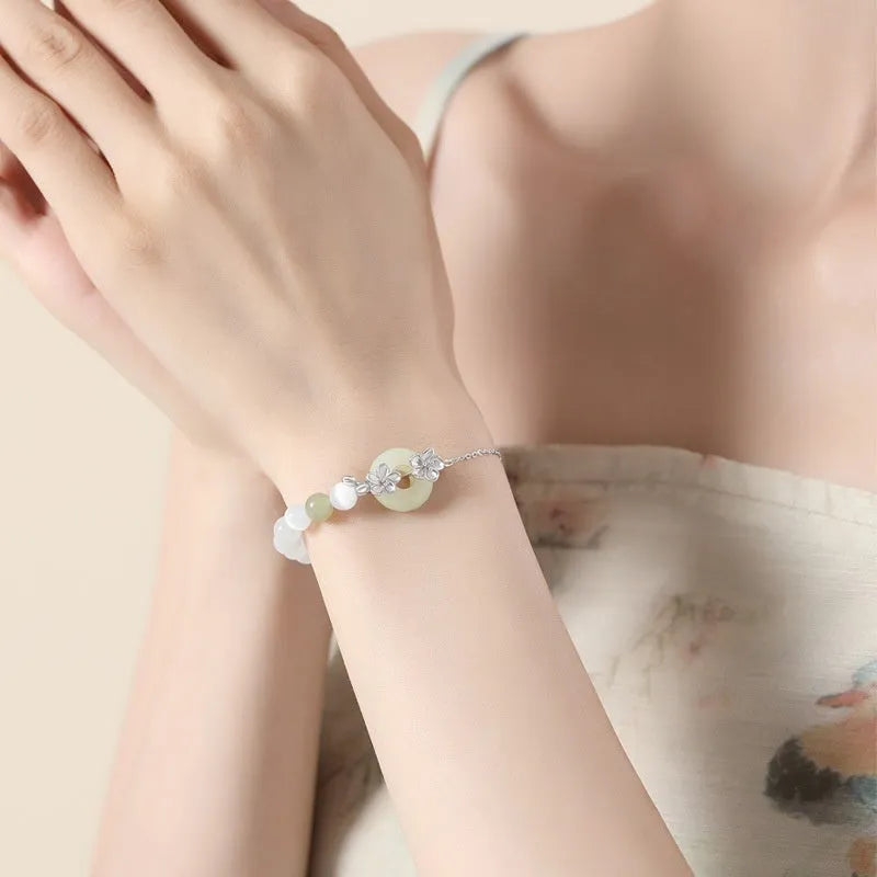 Women's pure silver bracelet with peach blossom safety buckle in New Chinese style flower design