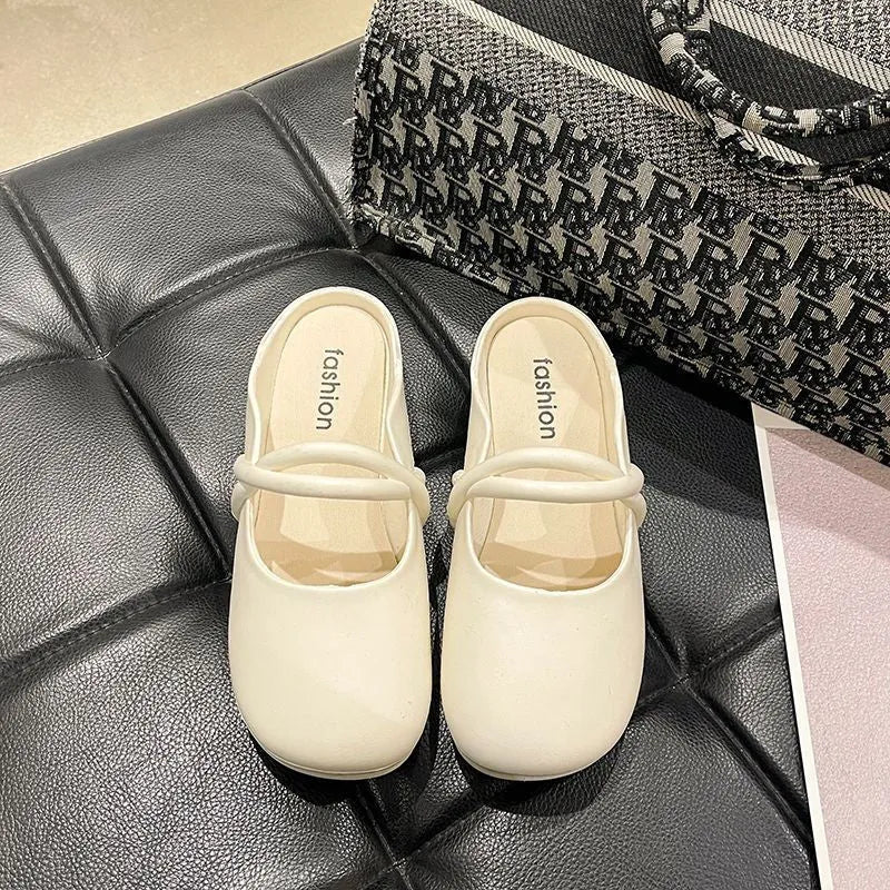 Women's plastic baotou flip flop sandals in green, shown from the side.