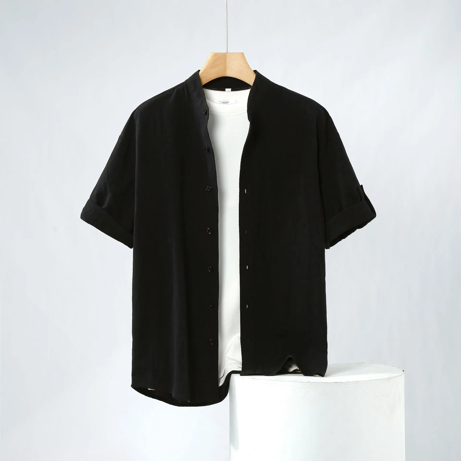 Men's loose short sleeve linen shirt in cotton blend with stand collar.