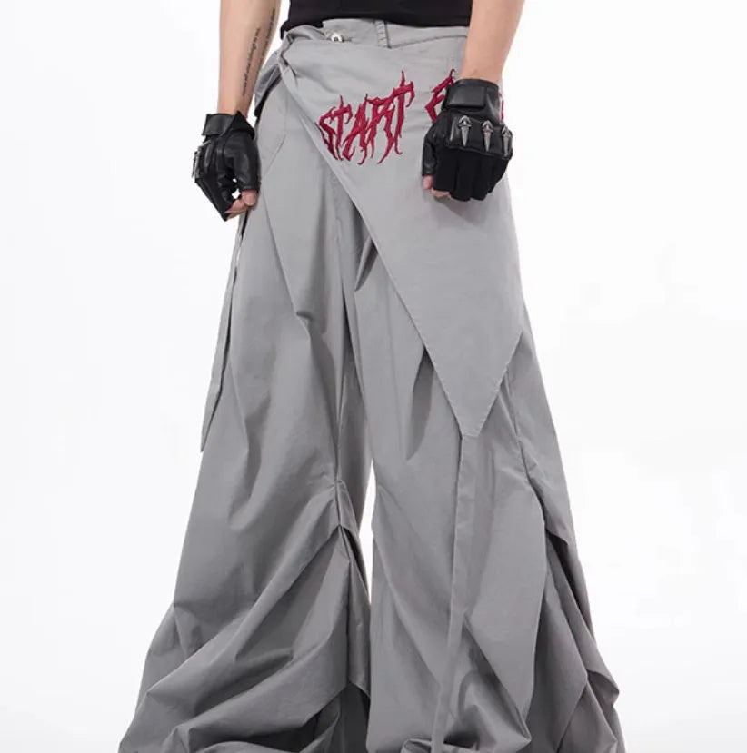 Boy wearing black wide-leg Korean style summer trousers with an elasticated waistband.