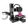 K9 mini 3D printer on a desk with small printed PLA model next to it.