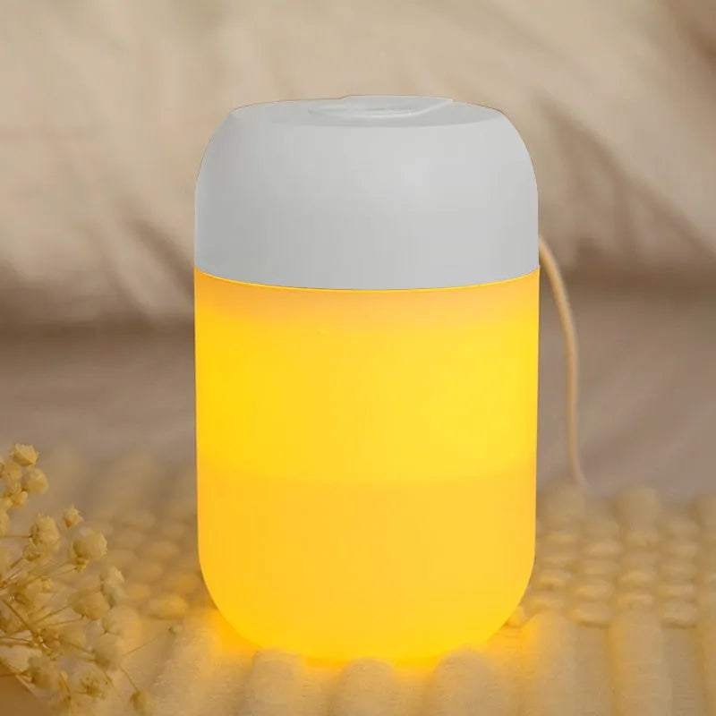 Small white cylindrical USB-powered humidifier for silent bedroom and desk use.