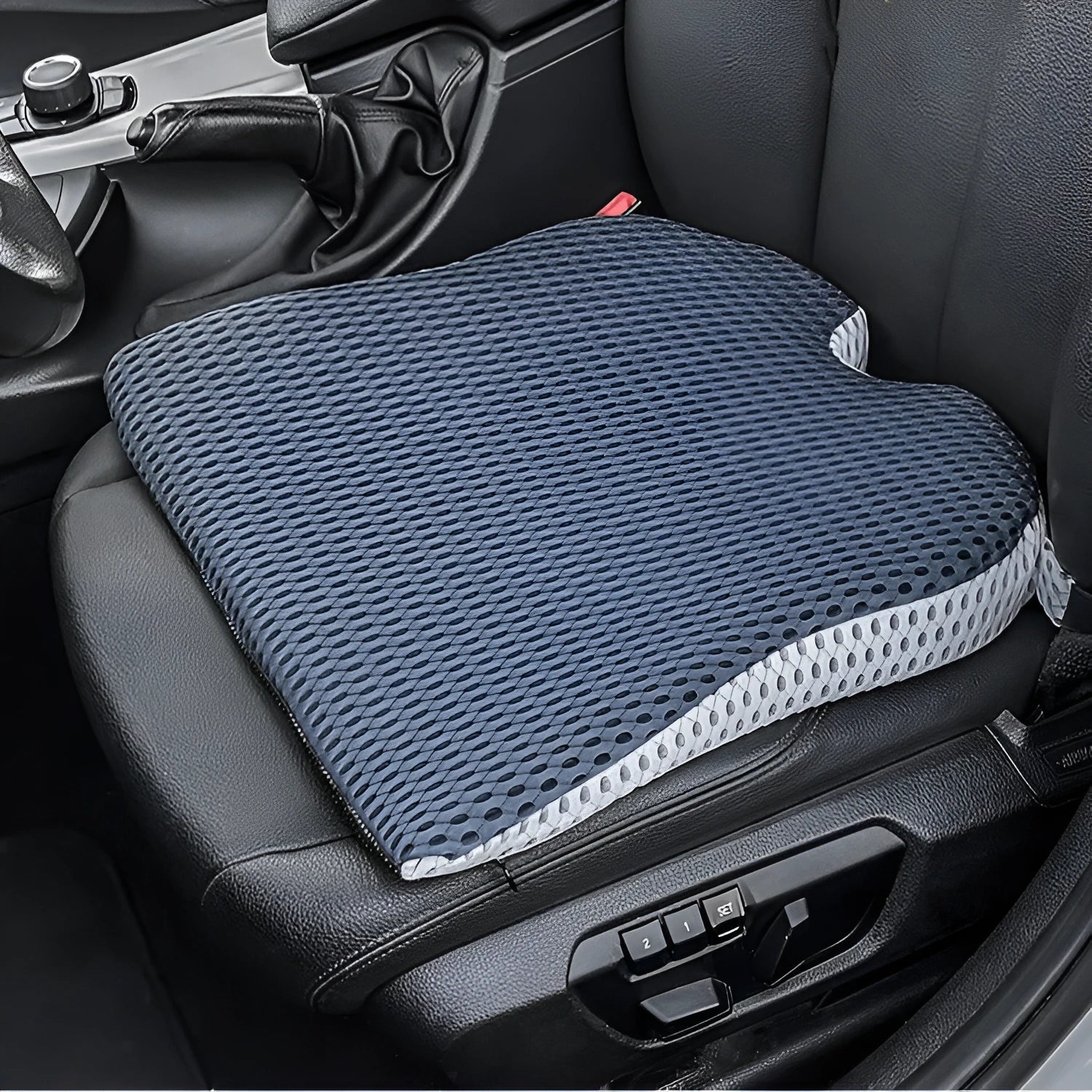 Memory foam car cushion with fixed strap attachment in black, grey, or creamy white
