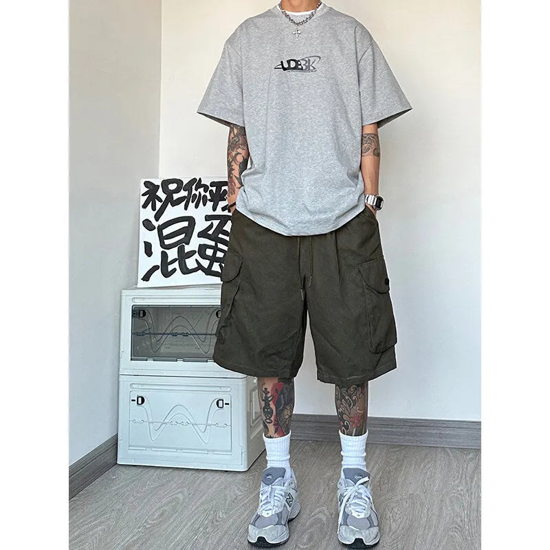 Loose straight casual sports shorts in polyester with micro elasticity, available in black, blue, green, and khaki colours