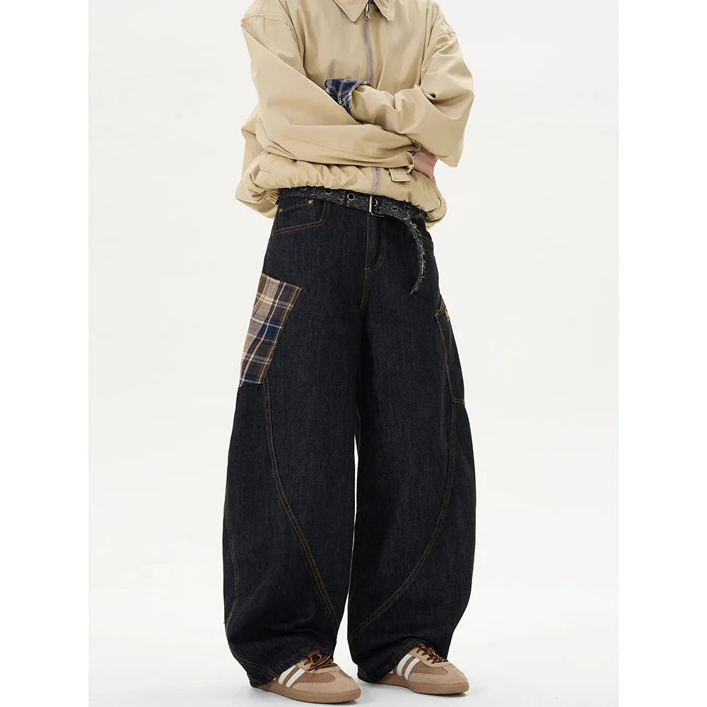 Man wearing loose straight-leg casual trousers in a red plaid pattern.